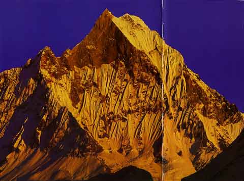 
Machapuchare blazes at sunset - Trekking in Himalayas book
